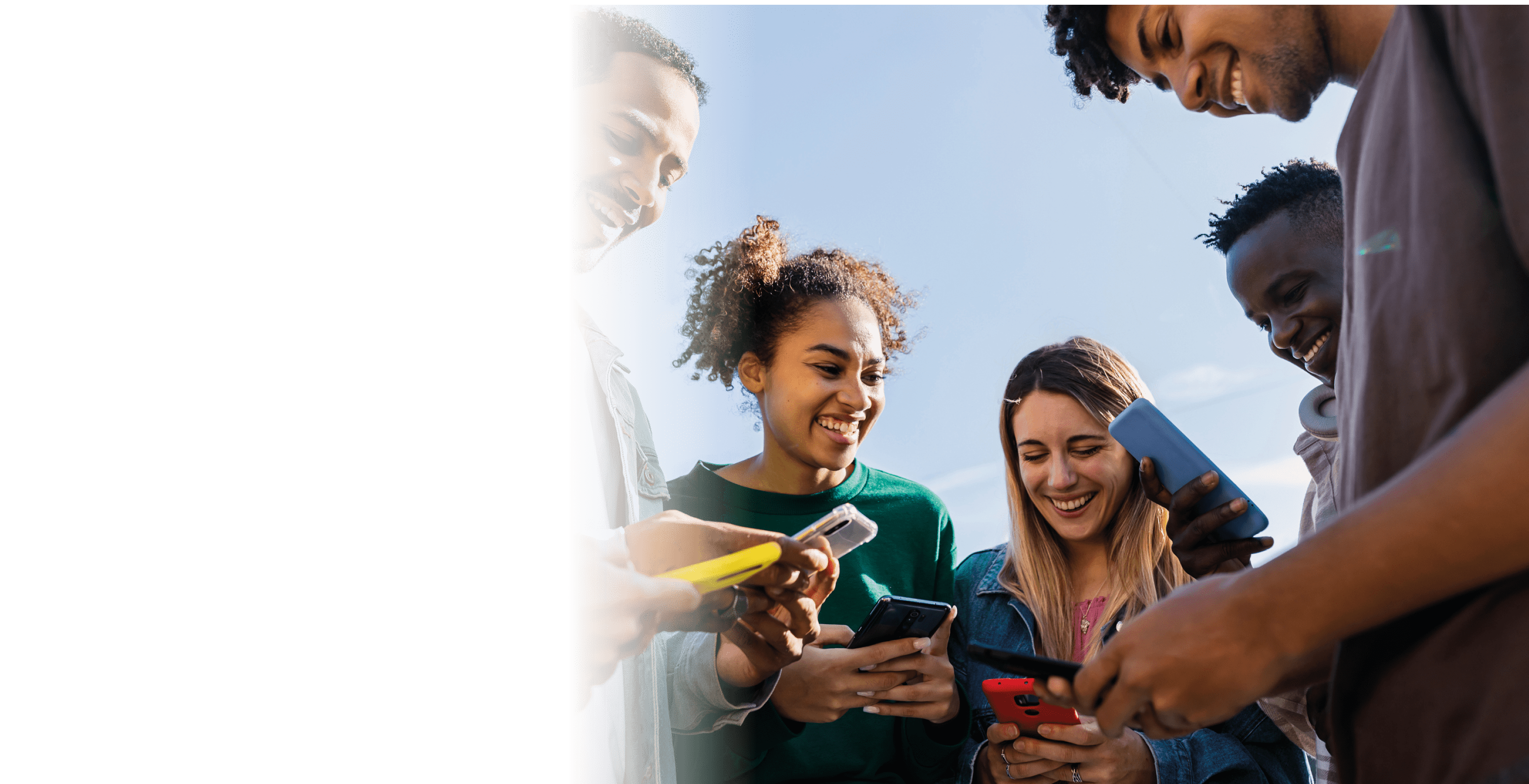 Young group of teenage student friends using smart phones outdoors. Youth and technology lifestyle concept