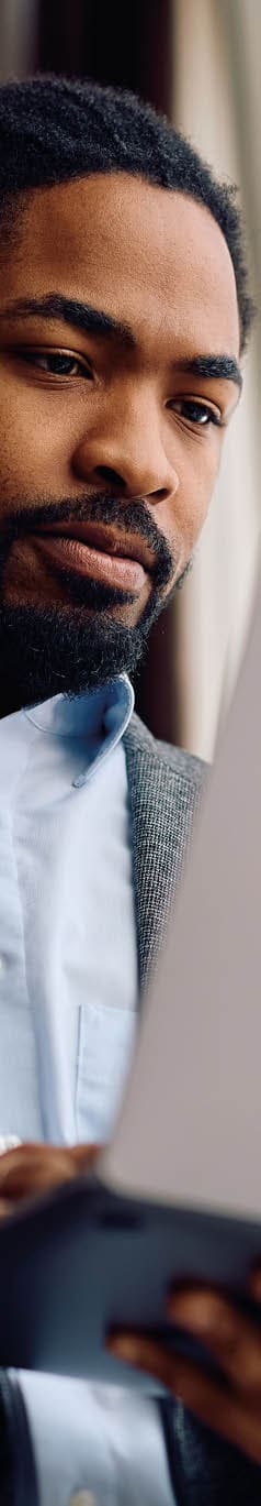 African American businessman working on laptop in the office. Copy space.