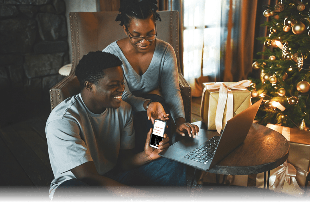 Young couple doing christmas shopping online