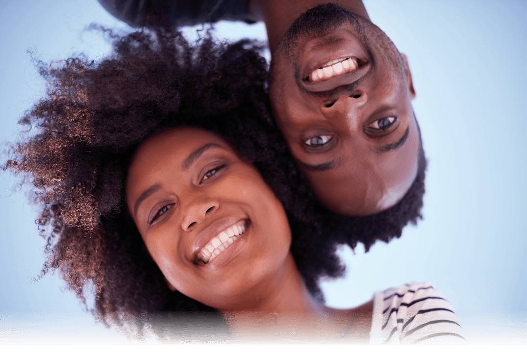 Low angle shot of a young attractive couple spending time together at the beach