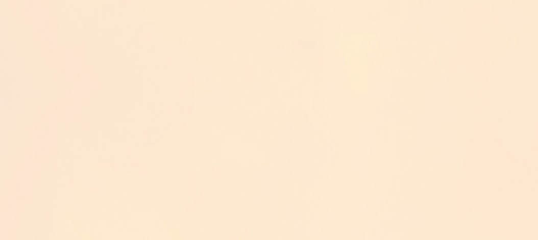 Relaxed, zen and healthy woman meditating on beach with arms raised in prayer pose and sitting legs crossed by sea or ocean. Calm, serene or peaceful yogi in holistic yoga breathing for mental health