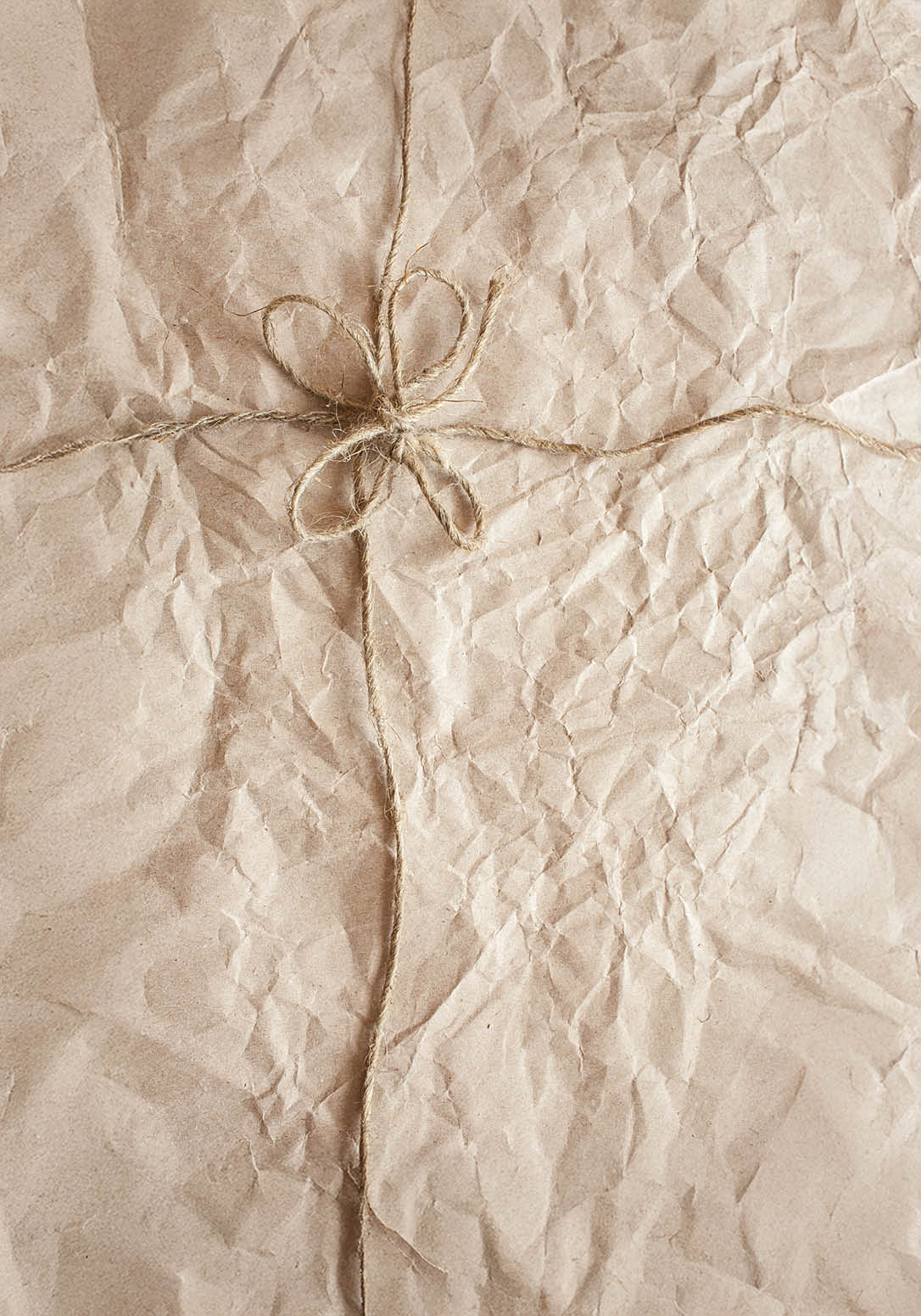 wrinkled old paper texture with rope wrap