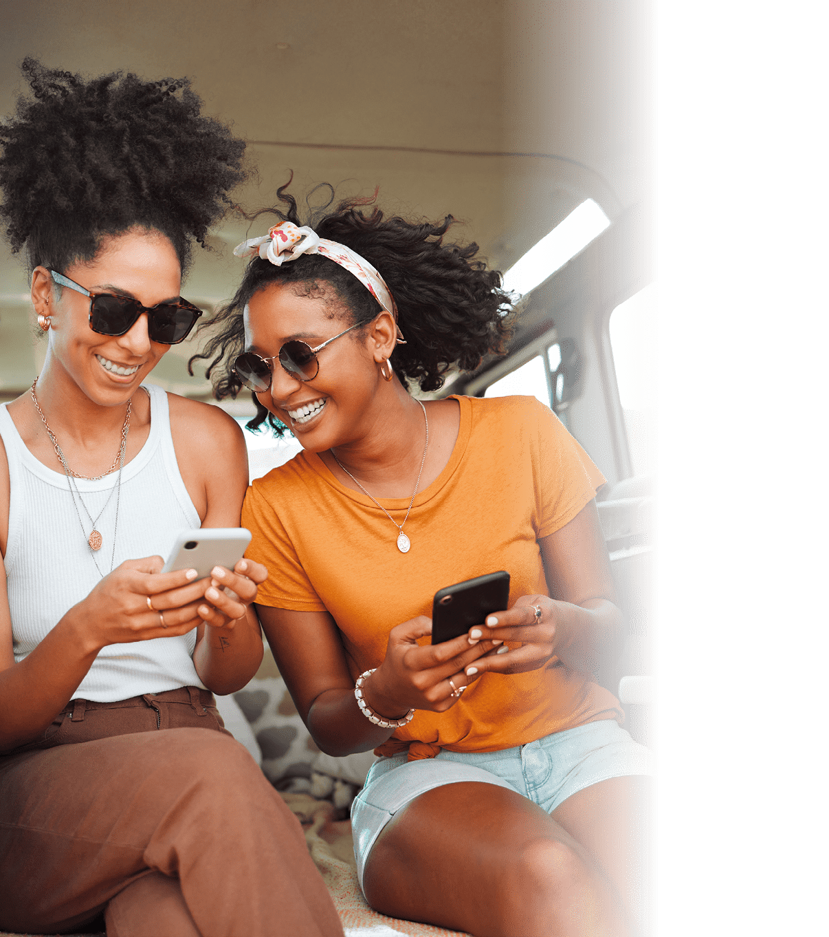 Women, road trip or phone for social media, gps location or map app for safari game drive or summer travel. Smile, happy or bonding friends with 5g mobile technology in camper van in nature landscape