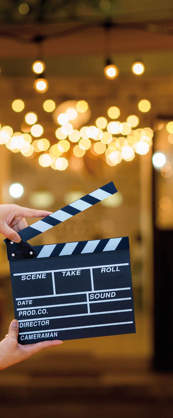 Man hands holding movie clapper. Film director concept. camera show viewfinder image catch motion in interview or broadcast wedding ceremony, catch feeling, woman hand hold a Film Slate over bokeh